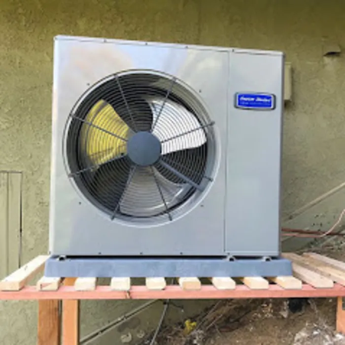 Heat pump outdoor unit on a raised stand