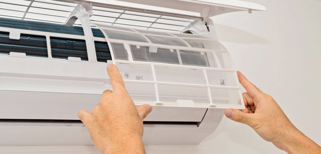 Photo of two hands completing a new A/C installation in Los Angeles