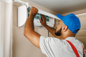 Air conditioner being professionally maintained
